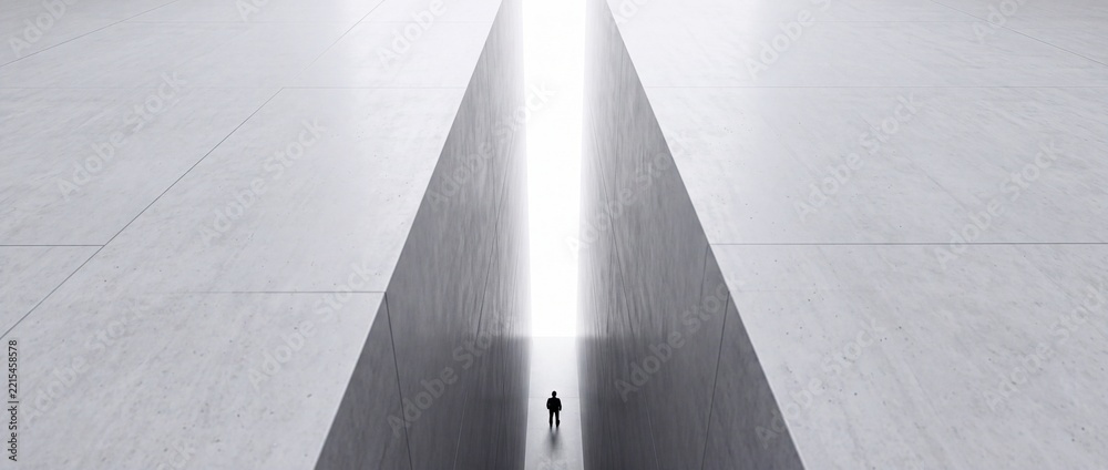 Fototapeta premium Minimalist high angle view of a businessman standing between massive concrete walls towards a bright light, symbolizing career challenges, perspective shift, and the path to future success.