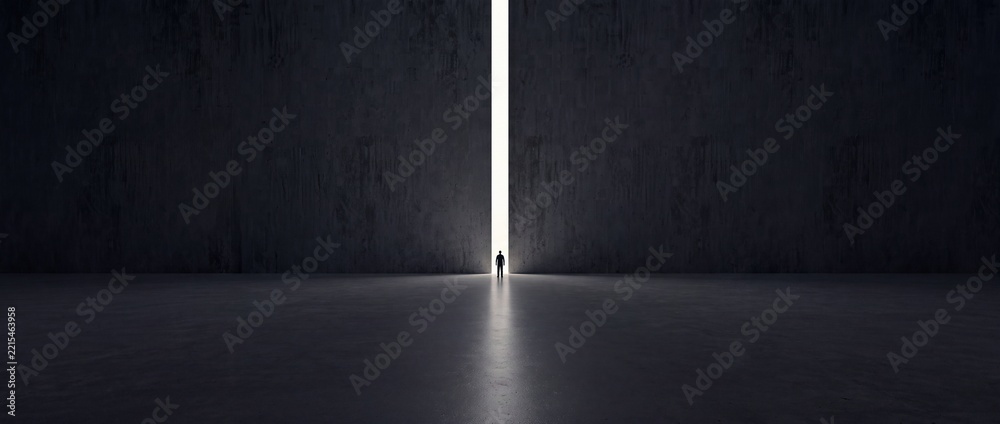 Naklejka premium Silhouette of a man standing in front of a giant opening in a dark massive concrete wall with bright light shining through, representing hope, new beginnings, opportunity and future goals.