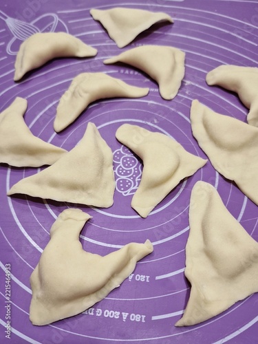 Uncooked vareniki. Pierogi. Ukrainian dumplings