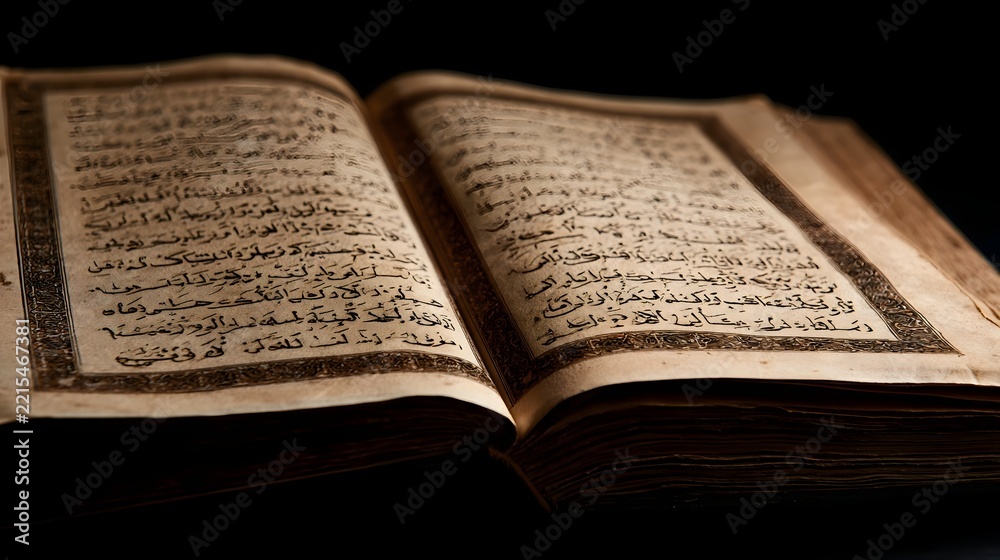 Fototapeta premium An open ancient book with intricate Arabic calligraphy on aged parchment pages under warm lighting