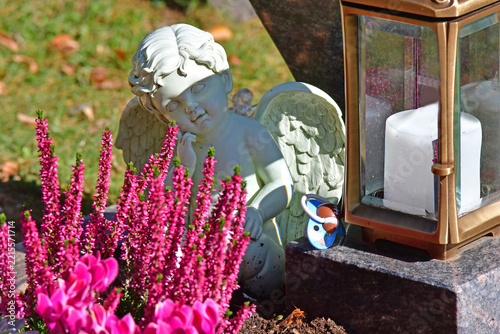 sweet dreaming angel figure on a grave