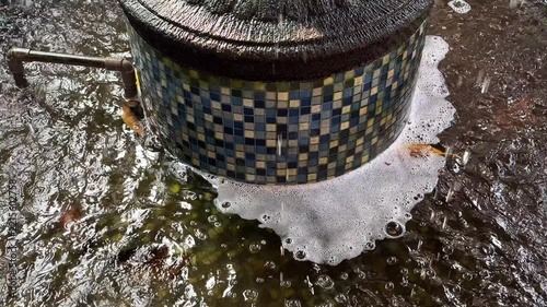 White Foam and Bubbles at Mosaic Fountain Base Slow Motion 4K Footage