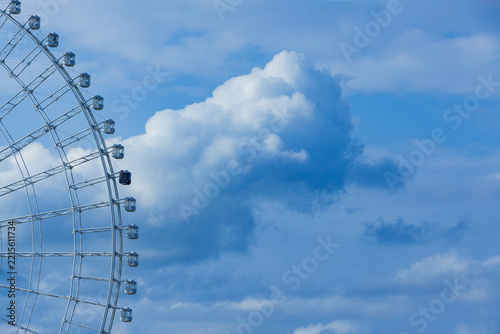 Ferris Wheel Against Blue Sky with Cumulus Clouds, Japan