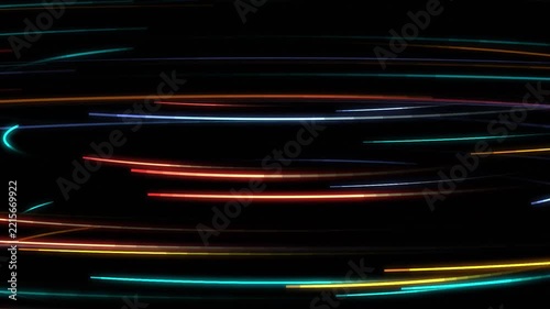 Fast colorful neon light streaks spinning across black space