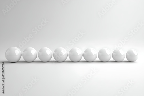 A row of nine white glossy spheres isolated on white background