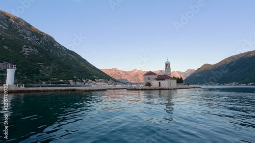 Our Lady of the Rocks church surrounded by mountains in Perast Kotor Bay