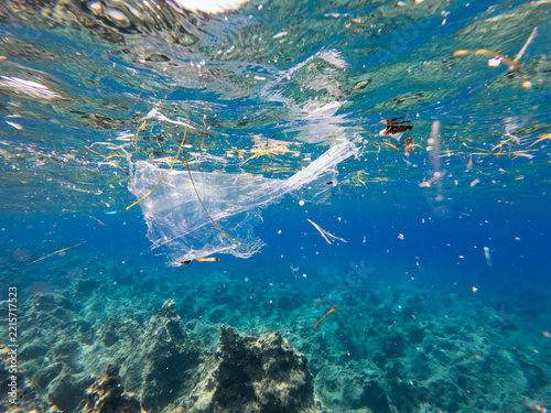 discarded plastic drifting beneath the surface