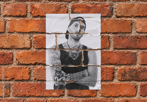Ripped Street Flyer Mockup on the Orange Brick Wall