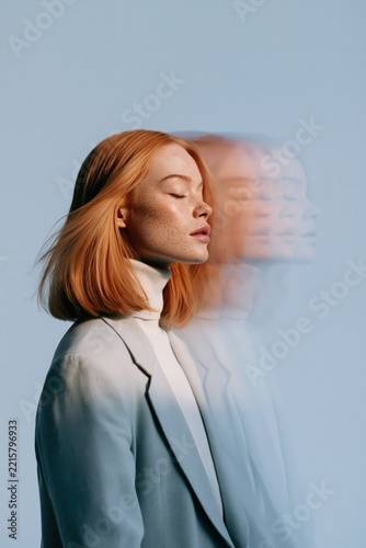 Redhead woman threefold motion blur portrait with multiple exposure streaks for fashion background and portrait artwork