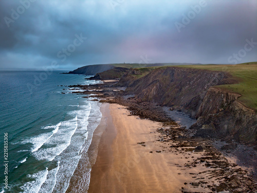 Moody autumn morning sky on Cornish beach