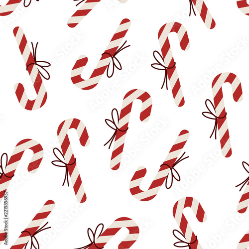 Seamless Christmas Candy Cane Pattern with Red and White Striped Peppermint Candies on White Background