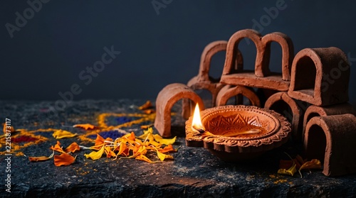 Traditional diya lamp with clay arches for diwali celebration lighting