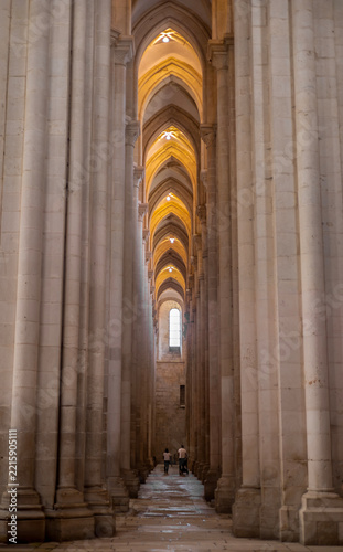 Two people in Alcobaça monastery, Portugal