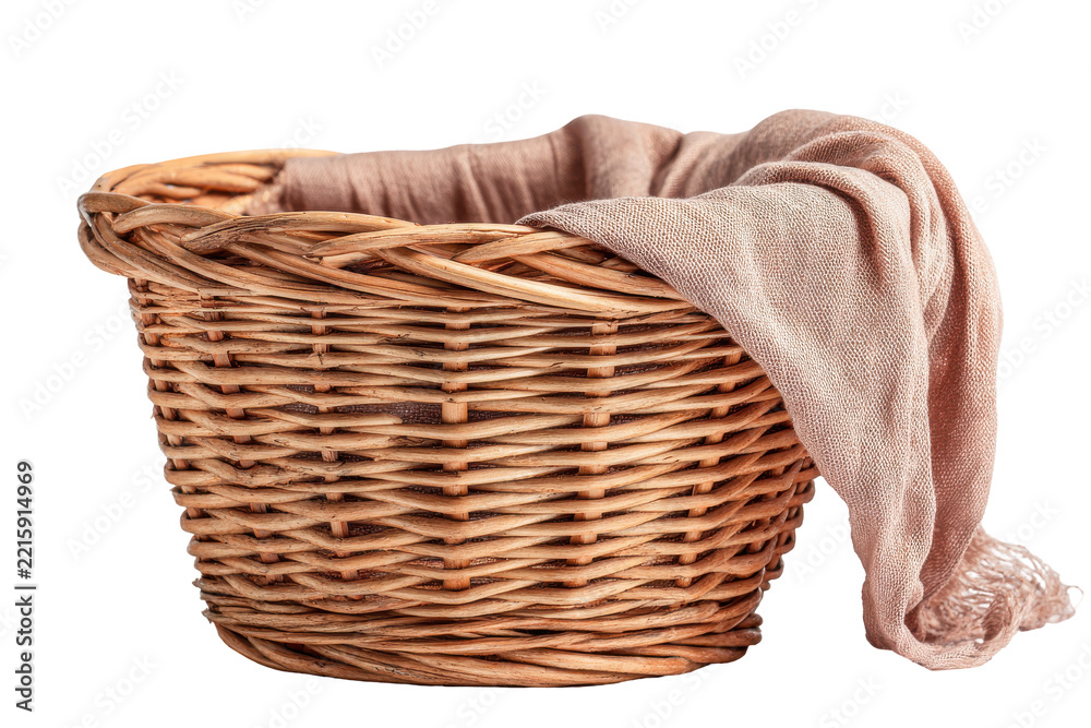 Obraz premium Wicker laundry basket with folded beige towel draped over side isolated on transparent background. Elegant wicker basket with soft pink blanket isolated on white background.