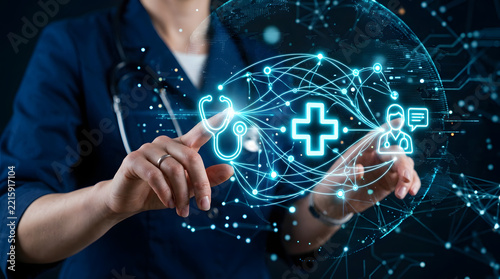 Physician touching digital medical network interface with stethoscope