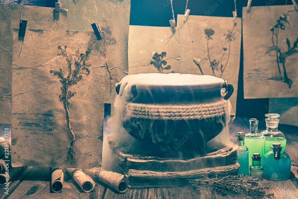 Naklejka premium Scary witcher cauldron for Halloween with potions and recipes.