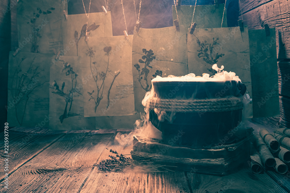 Naklejka premium Old witch cauldron with recipe and full of scrolls.