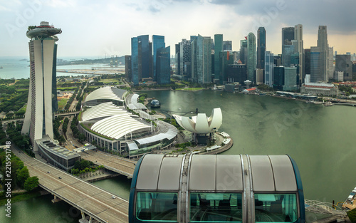 Tropical waterfront view in Singapore with palm trees and futuristic architecture of Gardens by the Bay. Perfect for travel, sustainability, and urban lifestyle concepts.