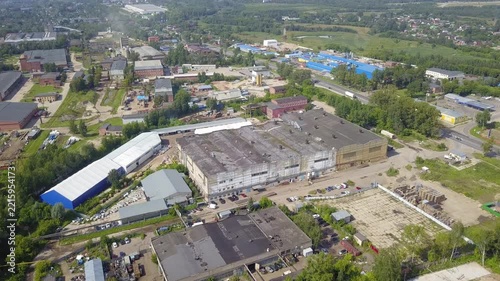 Drone flies forward and turns over Klin warehouses