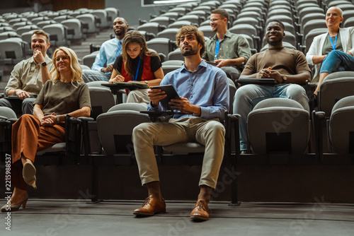Diverse audience attending a business seminar or lecture