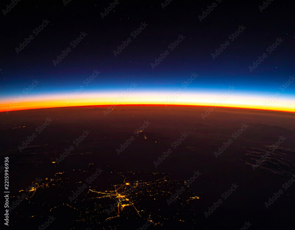Fototapeta premium Breathtaking aerial view of Earths glowing horizon at sunrise from space. Nobody present. This ethereal, cinematic image evokes wonder, unity, and cosmic scale, perfect for global technology.