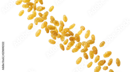 Falling golden raisins isolated on white background