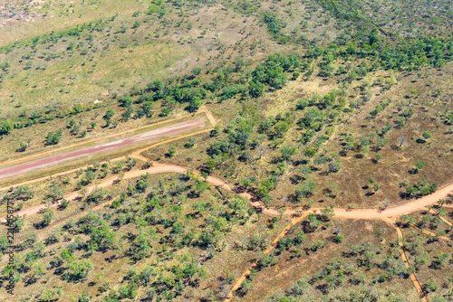 Fotografie Aerial landform views showing scattered trees typical of this area with narrow runway and tilted horizon in El Questro district