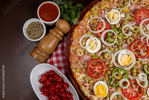 pizza with salami and tomatoes