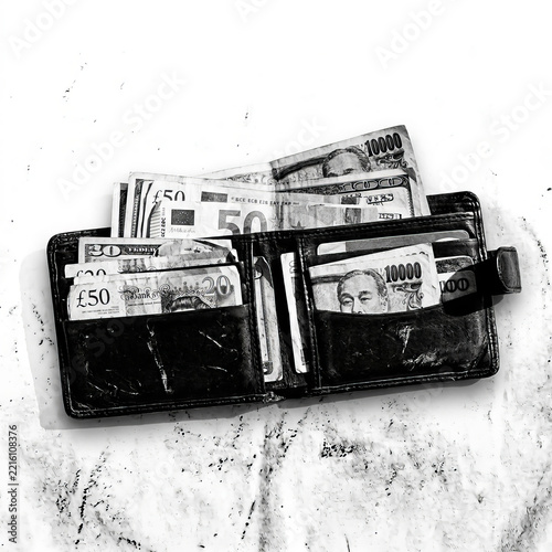 Top Down View of an Open Leather Wallet Stuffed with International Banknotes and Global Currency in Black and White
