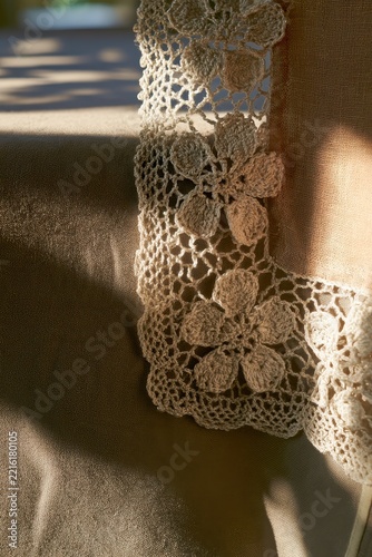 Close-up of Handmade Crocheted Lace Trim on Fabric