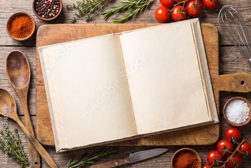 Open Blank Recipe Book with Fresh Vegetables and Spices on Wooden Table