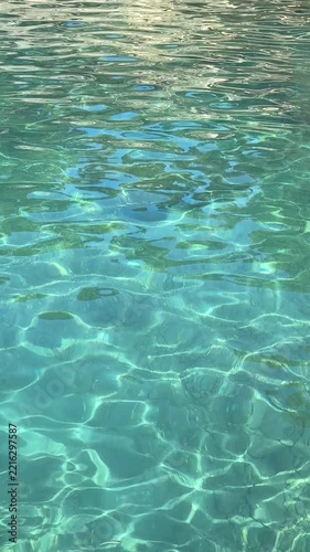 Sea water crystal-clear blue turquoise waves vertical video.
