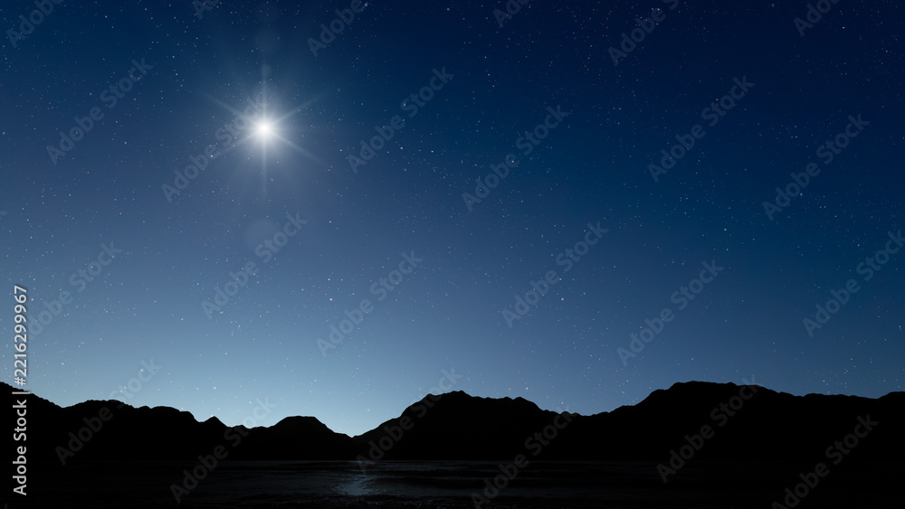 Fototapeta premium Glowing Christmas star above a peaceful mountain landscape