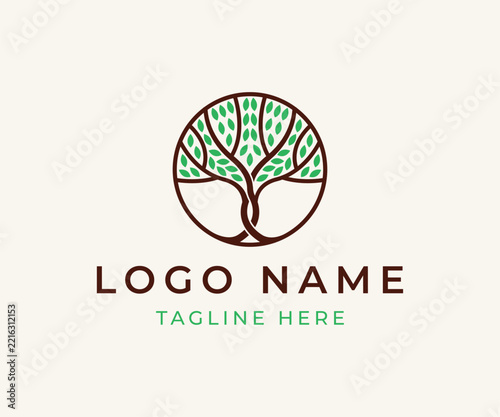 Minimalist circular tree logo with green leaves and dark brown branches