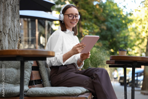 Digital nomad lifestyle and remote work, young woman using a tablet with head...
