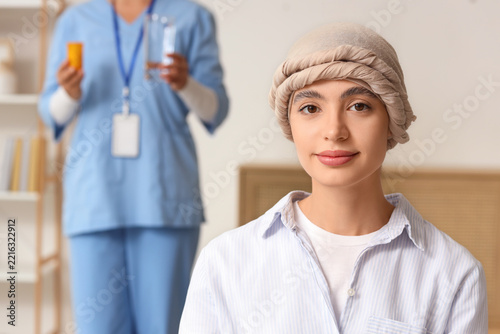 Cancer treatment and patient care, young woman with headscarf receiving suppo...