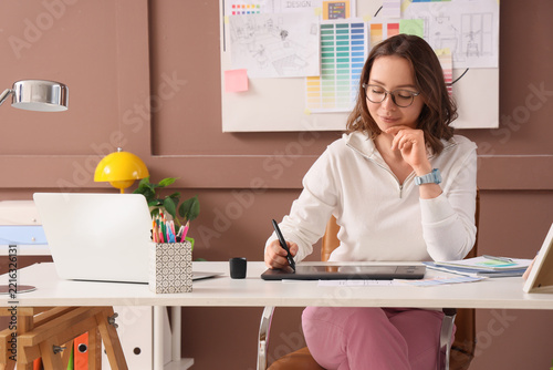 Graphic design and creative workflow, professional woman using digital tablet...