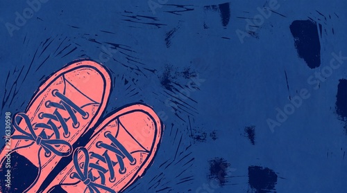 Pink sneakers resting on a blue textured background