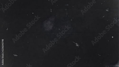 Old negative film overlay texture with dust particles and scratches for creative editing.