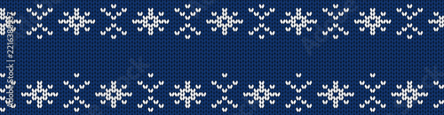 Winter seamless border. White and blue knitted pattern