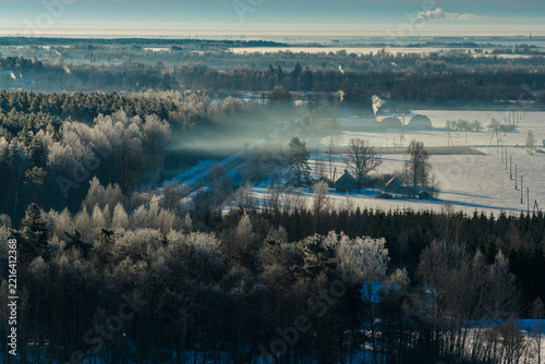 Winter landscape during sunrise in countryside , captured from above