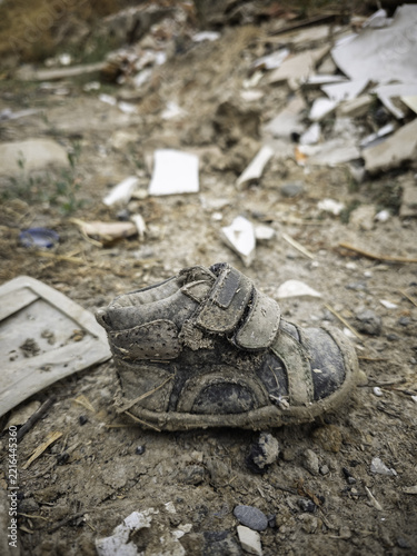 Baby shoe in the trash
