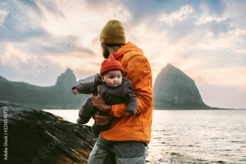 Father with infant baby enjoying active family holidays outdoors in Norway, happy parenting travel lifestyle parent with kid explore Helgeland islands autumn vacation adventure bonding love childhood