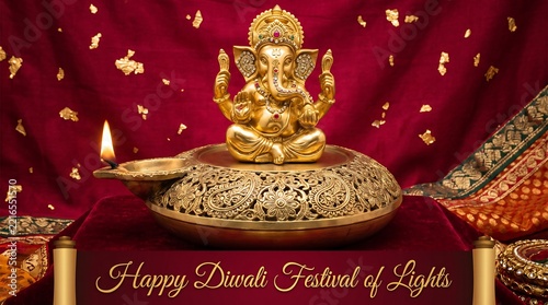 Golden Ganesha idol on ornate stand with diya flame during Diwali festival against rich fabric background