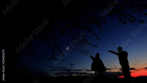 Amateur astronomers enjoying night sky with stars, planets, Moon eclipse and other celestial objects.