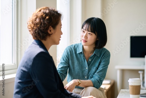 Generative AI, Supportive Woman Listening to a Colleague During an Office Conversation