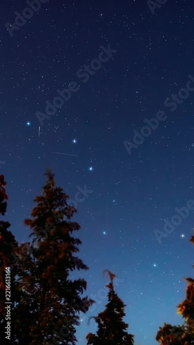 Constellations and Milky Way stars on a dark countryside skies. Time-lapse video.