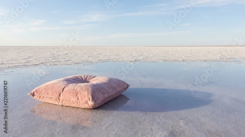 Pink Meditation Cushion on Reflective Water Surface at Dawn