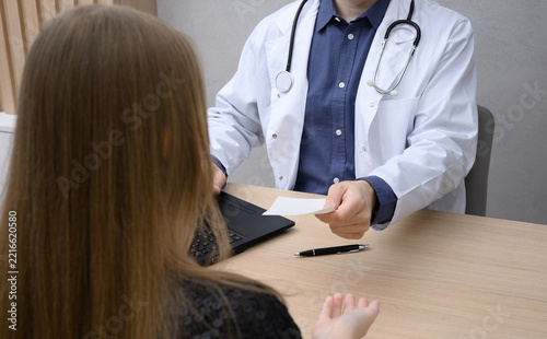 A visit to a doctor at a clinic, a patient talking to the doctor