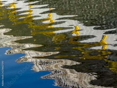 Colourful reflections on water surface